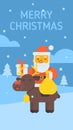 Santa sitting on reindeer holding gift bag and gift box