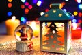 Santa Snow globe and Christmas pine lantern decoration Royalty Free Stock Photo