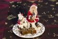 Santa and Snowman Candle playing instruments on decorative table
