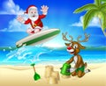 Santa Surfing and Reindeer on Tropical Beach Royalty Free Stock Photo
