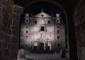 Santa Teresa church view through gate of the walls at night in Avila, Spain Royalty Free Stock Photo