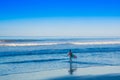 Santa Teresa, Costa Rica - June, 28, 2018: Young teen walking in the shore of the beach of Santa Teresa with his Royalty Free Stock Photo