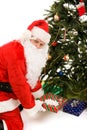 Santa Under Tree with Presents Royalty Free Stock Photo