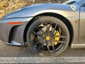 SANTA URSULA, SPAIN - JULY 10, 2023: Detail of the rim and tire of a silver gray Ferrari car parked on a street in Tenerife in
