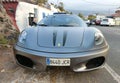 SANTA URSULA, SPAIN - JULY 10, 2023: Front view of a beautiful silver-gray Ferrari car, parked in a small town