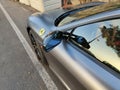 SANTA URSULA, SPAIN - JULY 10, 2023: Special view of the left side of a silver colored Ferrari parked in a small village