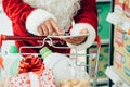 Santa using a tablet at the supermarket Royalty Free Stock Photo