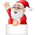 Santa waving and holding blank sign