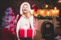 Santa woman posing. Sensual girl for Christmas. Glamour celebration new year. Blonde Santa woman holding gift box at