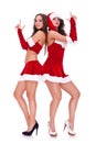 Santa women posing as secret agents Royalty Free Stock Photo