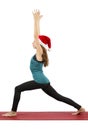 Santa yoga woman doing crescent pose Royalty Free Stock Photo