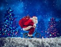 Santaclaus rides bike to deliver fast christmas gifts Royalty Free Stock Photo