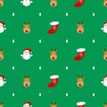 of santaclaus rudolph reindeer socks with red and white christmass tree pattern on green background Royalty Free Stock Photo