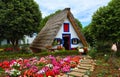 Traditional Madeira building with thatched roof.