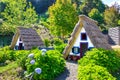 Santana, Madeira, Portugal - Sep 24, 2019: Traditional Madeiran houses with straw roofs in the Madeira Theme Park. Typical old