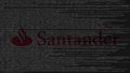 Santander Bank logo made of source code on computer screen. Editorial 3D rendering