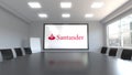 Santander Serfin logo on the screen in a meeting room. Editorial 3D rendering