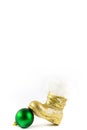 Santas golden boot with Christmas ball Royalty Free Stock Photo