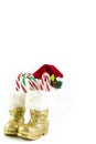 Santas golden boots and red hat with candy canes Royalty Free Stock Photo