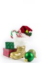 Santas golden boots and red hat with presents Royalty Free Stock Photo