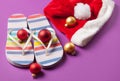 Santas hat and flip flops with christmas bubbles Royalty Free Stock Photo