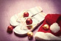 Santas hat and flip flops with christmas bubbles Royalty Free Stock Photo