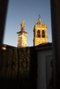 Santiago Apostle Church tower and Christ statue at sunset, Montilla