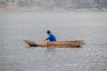 SANTIAGO ATITLAN, GUATEMALA - MARCH 23, 2016: Fishermen on traditional wooden boats on Atitlan lake near Santiago Royalty Free Stock Photo