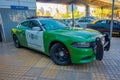 SANTIAGO, CHILE - OCTOBER 16, 2018: Outdoor view of green Police carabineros car parked in the city streets