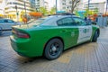 SANTIAGO, CHILE - OCTOBER 16, 2018: Outdoor view of green Police carabineros car parked in the city streets