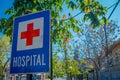 SANTIAGO, CHILE - SEPTEMBER 13, 2018: Close up of informative sign of red cross in metallic structure of Hospital close