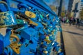 SANTIAGO, CHILE - SEPTEMBER 13, 2018: Close up of love locks padlocks chained to footbridge over the river mapocho