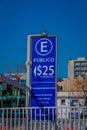 SANTIAGO, CHILE - SEPTEMBER 13, 2018: Outdoor view of informative sign of fee parking area per minut located in the