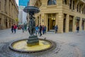 SANTIAGO, CHILE - SEPTEMBER 14, 2018: Unidentified people walking in the square close to a fountain in Historic center