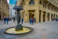 SANTIAGO, CHILE - SEPTEMBER 14, 2018: Unidentified people walking in the square close to a fountain in Historic center