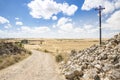 Santiago cross on a country road on a summer day between Hornillos del Camino and Hontanas, Burgos, Spain