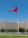 Chileans walking near the giant flag on Avenida La Alameda with