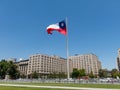 Chileans walking near the giant flag on Avenida La Alameda with