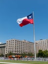 Chileans walking near the giant flag on Avenida La Alameda with