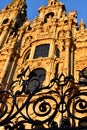 Santiago de Compostela, Spain. Cathedral, facade close up with iron fence and sunset light.