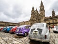 Santiago de Compostela, Spain - Jun 19, 2023: Vintage Seat cars in front of the Palace of Raxoi