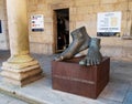 SANTIAGO DE COMPOSTELA, SPAIN - September 13, 2020:Feet sculpture with medical plaster near the Cathedral on the Quintana square Royalty Free Stock Photo