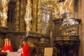 world famous censer in action with archbishop on background. Botafumeiro the biggest censer in world in Cathedral of Saint James