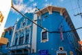 Santiago de Cuba, Cuba: Blue building in a classic style with white decor and a sign with the inscription of the CUBE.