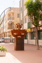 SANTIAGO DE LA RIBERA, SPAIN - JUNE 12, 2022 The sculpture depicts a carnival mask, topped by three seahorses, the distinctive Mar Royalty Free Stock Photo