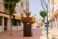 SANTIAGO DE LA RIBERA, SPAIN - JUNE 12, 2022 The sculpture depicts a carnival mask, topped by three seahorses, the distinctive Mar Royalty Free Stock Photo