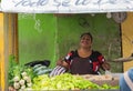 SANTIAGO DE LOS CABALLEROS - JUNE 20, 2019: Business woman at farmer market in the city of Santiago de los Caballeros, DR