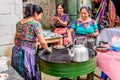 Local Maya women make tortillas in the street, Santiago Sacatepequez, Guatemala Royalty Free Stock Photo