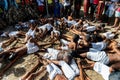 Members of the cultural manifestation Nego Fugido lying on the ground for the end of slavery