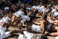 Members of the cultural manifestation Nego Fugido lying on the ground for the end of slavery